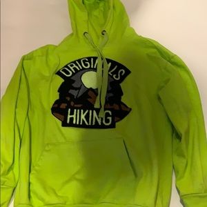 A lime green hoodie and original hiking patch